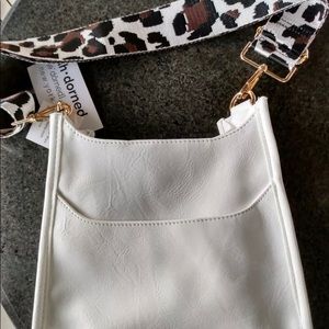 Ahdorned  crossbody bag including strap